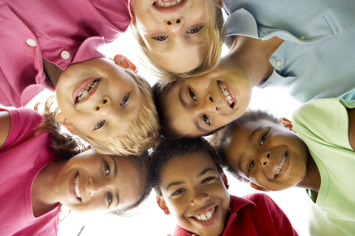 Group Of Children Playing In Park