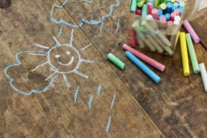 Child's drawings and coloured chalk