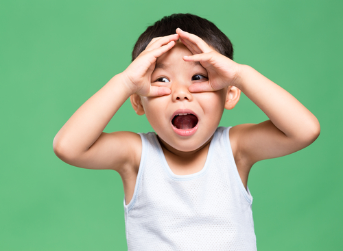 Excited little asian boy