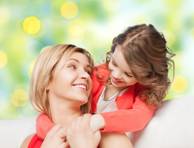 mother with daughter hugging and talking