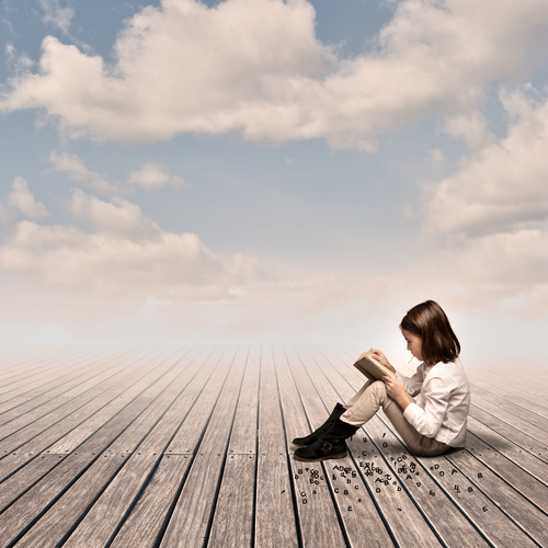 little girl reading a book