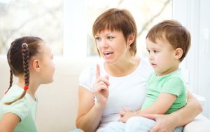 Mother talking to her children