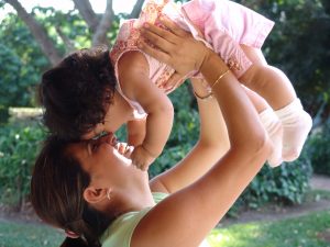 mom holding child