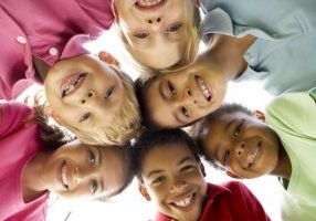 Group Of Children Playing In Park