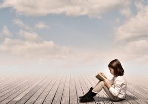 little girl reading a book