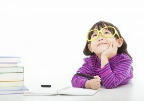 girl with glasses thinking